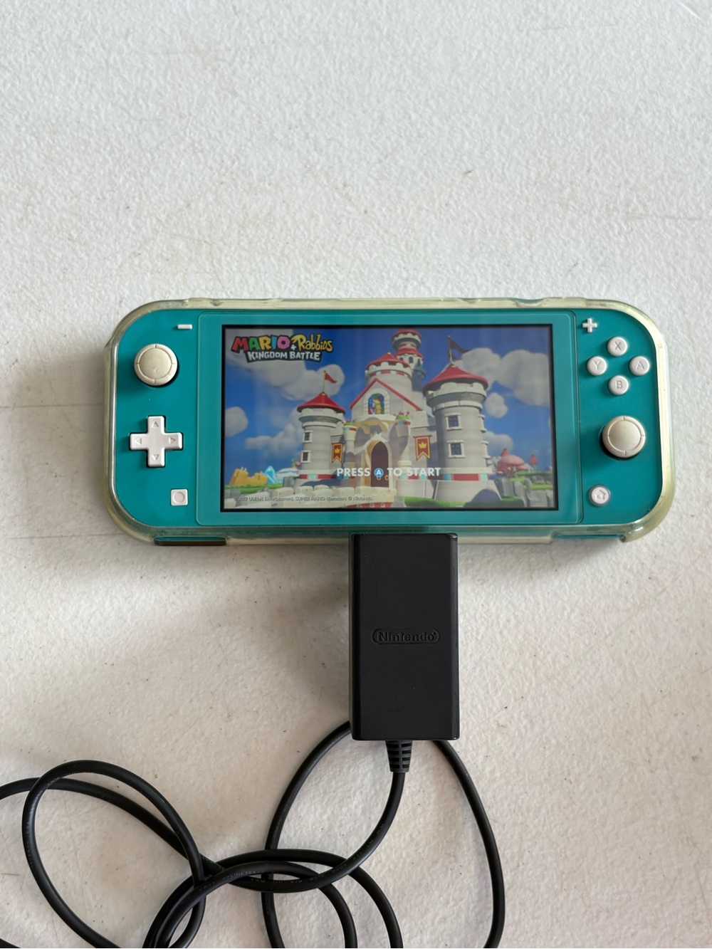 Nintendo Switch Lite console system with controller and cord. No Games.